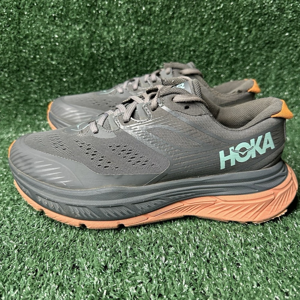 Hoka One One Men's Gray Athletic Running Shoes with Orange Sole and Aqua Logo